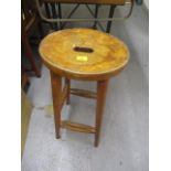 An early 20th century beech bar stool with a cut-out seat, raised on turned legs