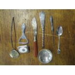 A selection of white metal, silver and other items to include two coin spoons