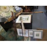 A mixed lot of parasols, walking sticks, a spear, pictures including two watercolours and a sea