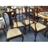 A set of four matched Queen Anne style mahogany dining chairs