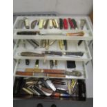 A collection of pocket knives, Swiss Army knives, pen knives, fruit knives and hunting knives,