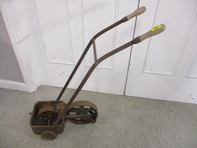 A vintage iron white line marker