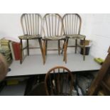 An Ercol set of four Windsor spindle back dining chairs, with detachable loose cushions