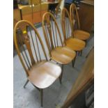 A set of four mid 20th century Ercol, swan back dining chairs