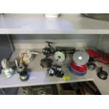 A selection of fishing reels to include a Ryobi 455 reel in a case and two wallets of fishing flies