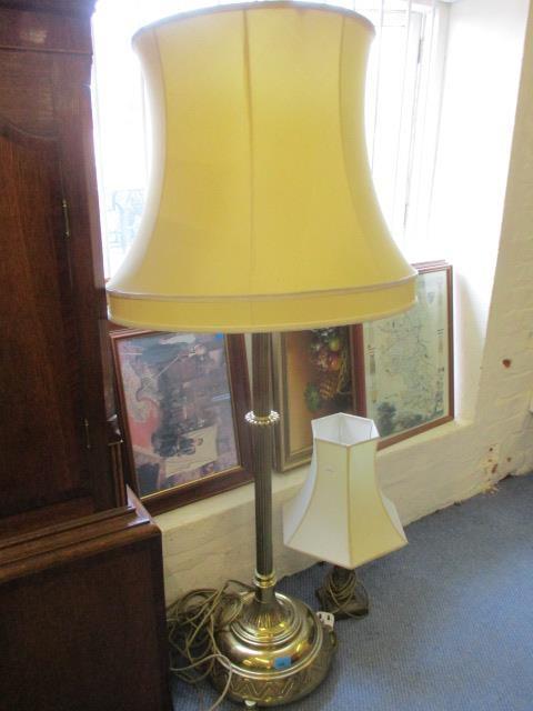 A mid 20th century brass standard lamp with shade, together with a brass table lamp and shade