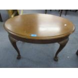 An early 20th century mahogany, oval topped occasional table, standing on ball and claw feet, 16 1/