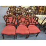A set of ten matched Victorian mahogany, cloud back dining chairs