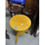 Two mahogany wine tables, together with a light wood swivel stool