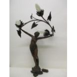 After L Beck an Art Nouveau cast spelter lamp fashioned as a woman holding a vine with three light