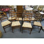 A set of four Ercol ladder back chairs and a matched set of another four Ercol ladder back chairs