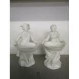 A pair of 19th century German blanc de chine figural salts, marks to base, 8" h