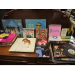 Mixed 1950s to 1980s LPs and 45rpm records to include Barbara Streisand, Abba, Frank Sinatra, Queen,