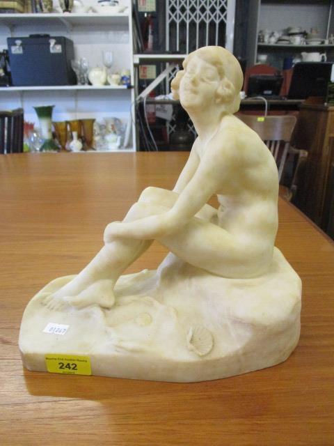 A marble figure of a nude female, 10 1/4" h x 10" w