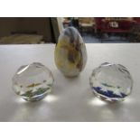 A pair of silver crystal paperweight and an Isle of Wight paperweight