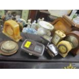 An assortment of clocks to include car clocks, mantel clocks and others