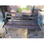 A teak and wrought iron garden bench 28"h x 50"w