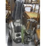 A set of golf clubs with trolley and bag