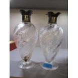 A pair of early 20th century silver topped, cut glass decanter, 9" h