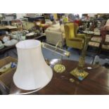 A brass table lamp with a fabric shade and a brass effect desk lamp