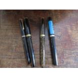 Four mixed fountain pens