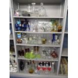 A large lot of glassware to include decanters, drinking glasses, vases, boxed glassware, Venetian