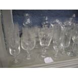 A mixed lot of cut glass and etched Champagne flutes, wine glasses, beer glasses A/F