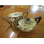 Two early 20th century silver teapots, one Adams style, total weight 1073g