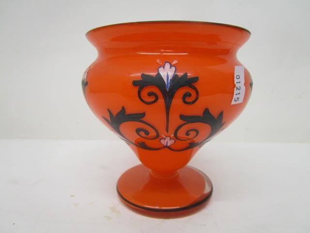 A Czechoslovakian orange coloured Tango glass vase with black and white enamel, floral decoration,