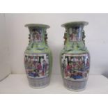 A pair of late 19th century Chinese Canton porcelain vases of baluster form, with flared necks,