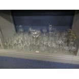 A mixed lot of cut glass and etched Champagne flutes, wine glasses, beer glasses A/F, a mixed lot of