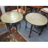 Two early 20th century Middle Eastern brass topped occasional tables