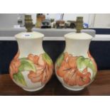 A pair of Moorcroft Hibiscus pattern table lamps, 10"h