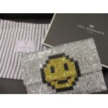 An Anya Hindmarch clutch bag with glitter design, with matching dust bag and box