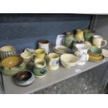 A selection of Holkham pottery items to include vases, tankards, jugs and other items