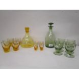 Barnaby Powell designs for Whitefriars glass, two decanter and glass sets, the first in pattern M60,