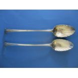 A pair of George III silver Onslow pattern basting spoons by I L London 1788 with shell design