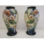 A pair of Moorcroft pottery Quiet Waters pattern vases, 46/10, decorated with opposing fish, 10" h