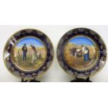 A pair of Alexandra Porcelain Works, Vienna plates, one printed with a man and a woman after picking