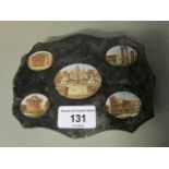 A 19th century Italian Grand Tour micro mosaic slate plaque, with a scalloped edge, inset with