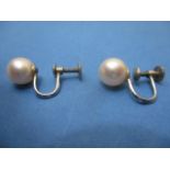 A pair of white gold coloured metal screw earrings, set with a single pearl, stamped 14k, 8mm dia,