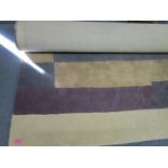 An Indian John Lewis hand tufted wool pile rug in urban cassis/steel colours 230cm x 160cm