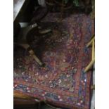 A middle eastern red grand rung having multi guard borders and a foliate design 80" x 53"