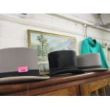 A Harrods grey top hat and two others