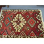 A group of rugs to include two Bokara rugs, a Persian rug and a Turkish rug