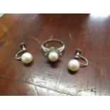 A pair of white gold coloured metal screw earrings, set with a single pearl, stamped 14k, 8mm dia,