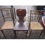Three chairs to include a Regency mahogany hall chair and two early 20th century side chairs
