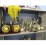 A mixed lot of silver plate to include candlesticks, bookends, jugs and other items