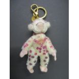 A modern Prada key ring/handbag charm in the form of a fabric monkey