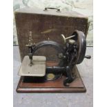 A Willcox & Gibbs sewing machine with original box